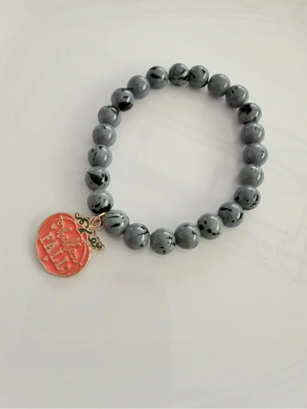 Gray Beaded Stretch Bracelet with Orange Pumpkin Charm